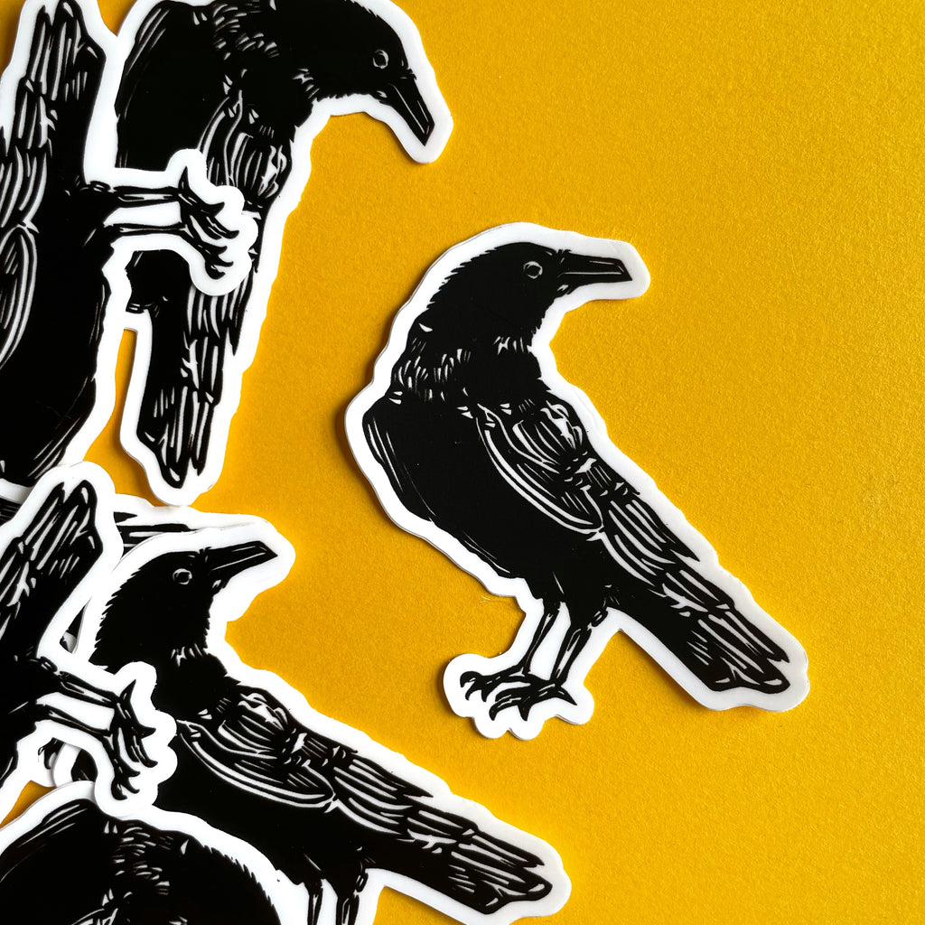 Black crow raven sticker on yellow background