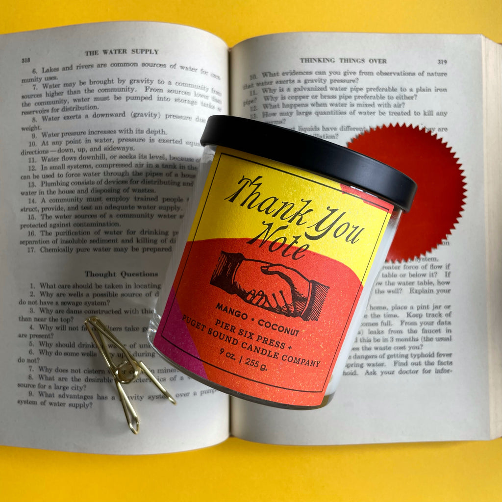 Thank you note hand made candle in glass jar with lid. Neon yellow and orange letterpress label.