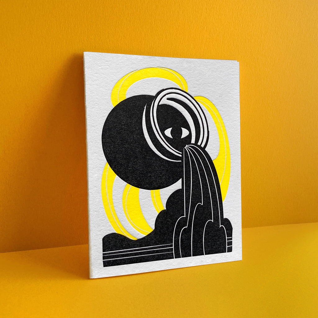 Aquarius letterpress birthday card. Black urn with all seeing eye pouring water into a esoteric waterfall. Neon yellow pattern in background symbolizing air element.